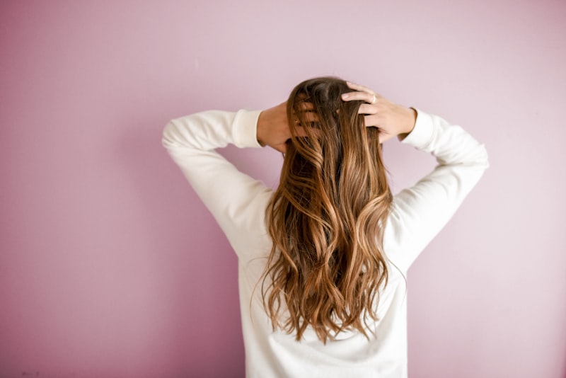 Soft layered brunette haircut with natural waves