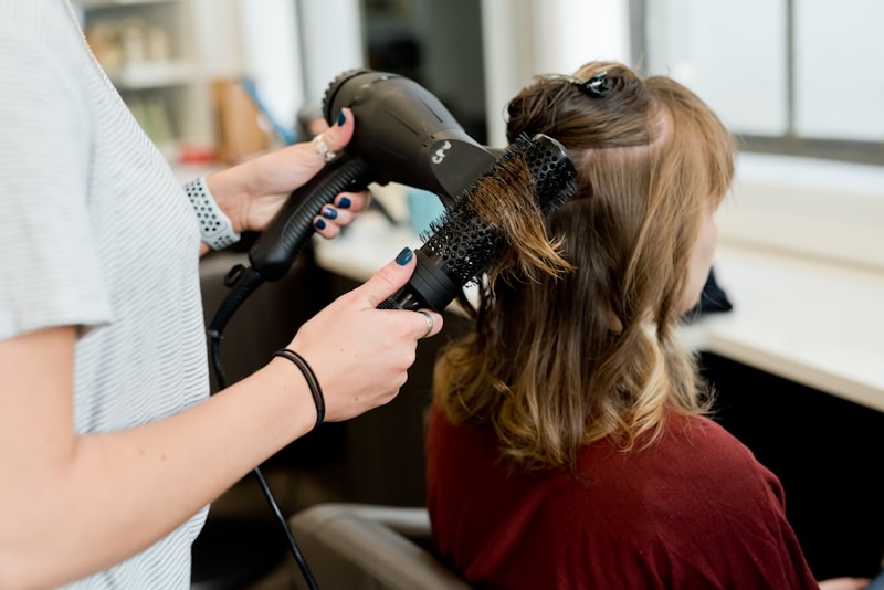 Professional hair styling in salon chair